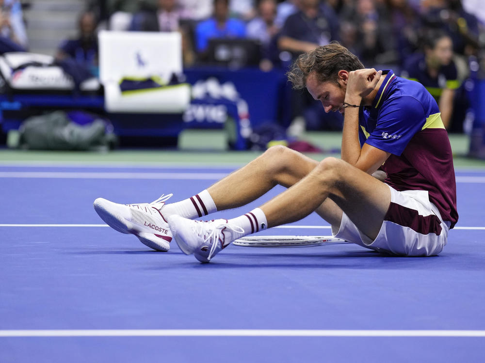 Daniil Medvedev, of Russia, sits on the court after a rally against Novak Djokovic, of Serbia, during the men's singles final of the U.S. Open tennis championships on Sunday in New York.