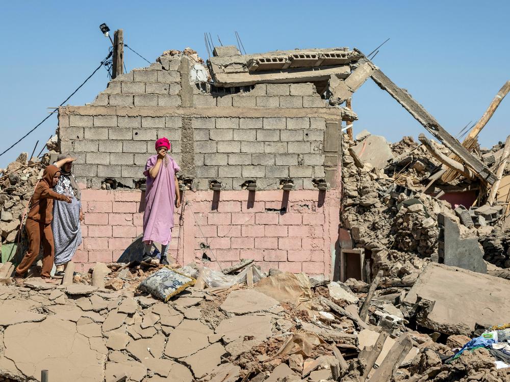 Villagers inspect the rubble of collapsed houses in Tafeghaghte, southwest of Marrakesh, on Sept. 10.