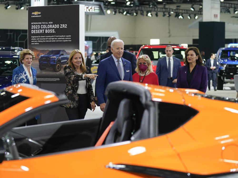 Biden tours the Detroit Auto Show in September 2022 with General Motors CEO Mary Barra (left of Biden), Rep. Debbie Dingell (right of Biden) and others.