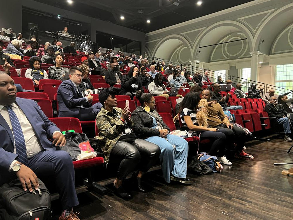 People listen to the California reparations task force in Oakland, Calif., at one of its final meetings in May.