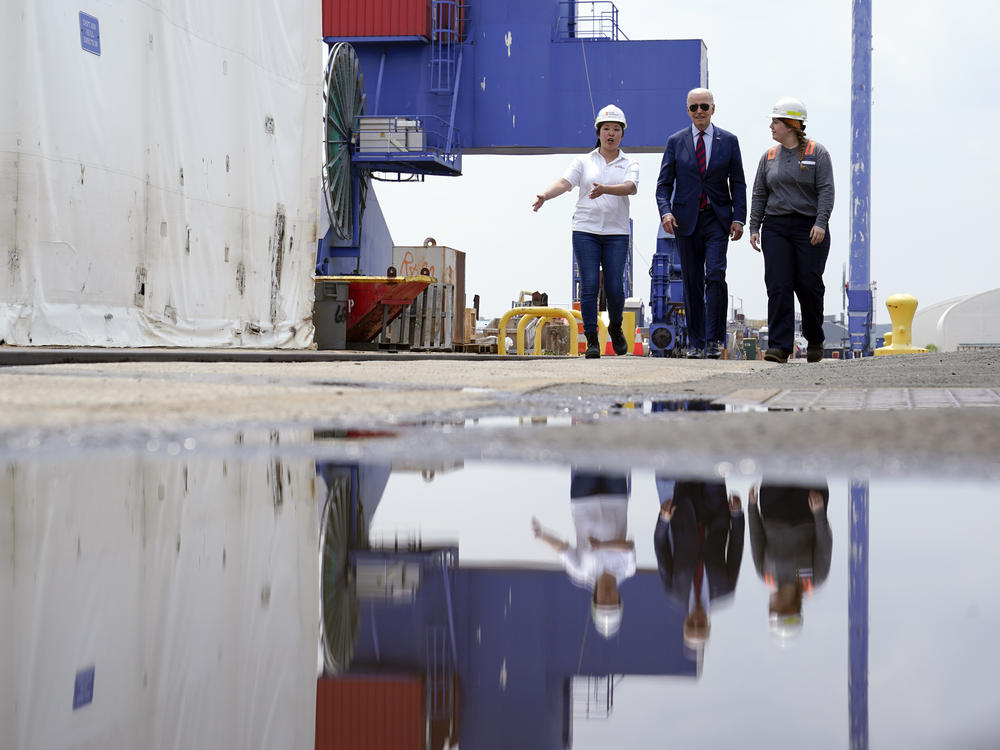 President Biden tours a shipyard in Philadelphia with two union members on July 20 before giving remarks about unions and clean energy jobs.