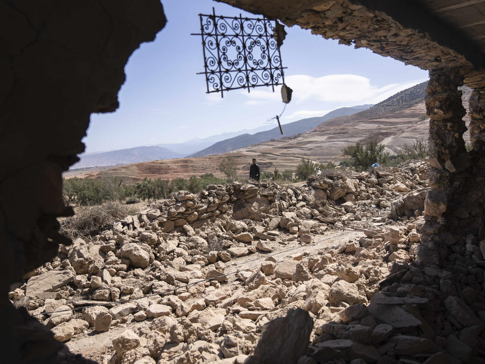 A man walks past rubble caused by the earthquake in the village of Tafeghaghte, near Marrakech, Morocco, on Monday.