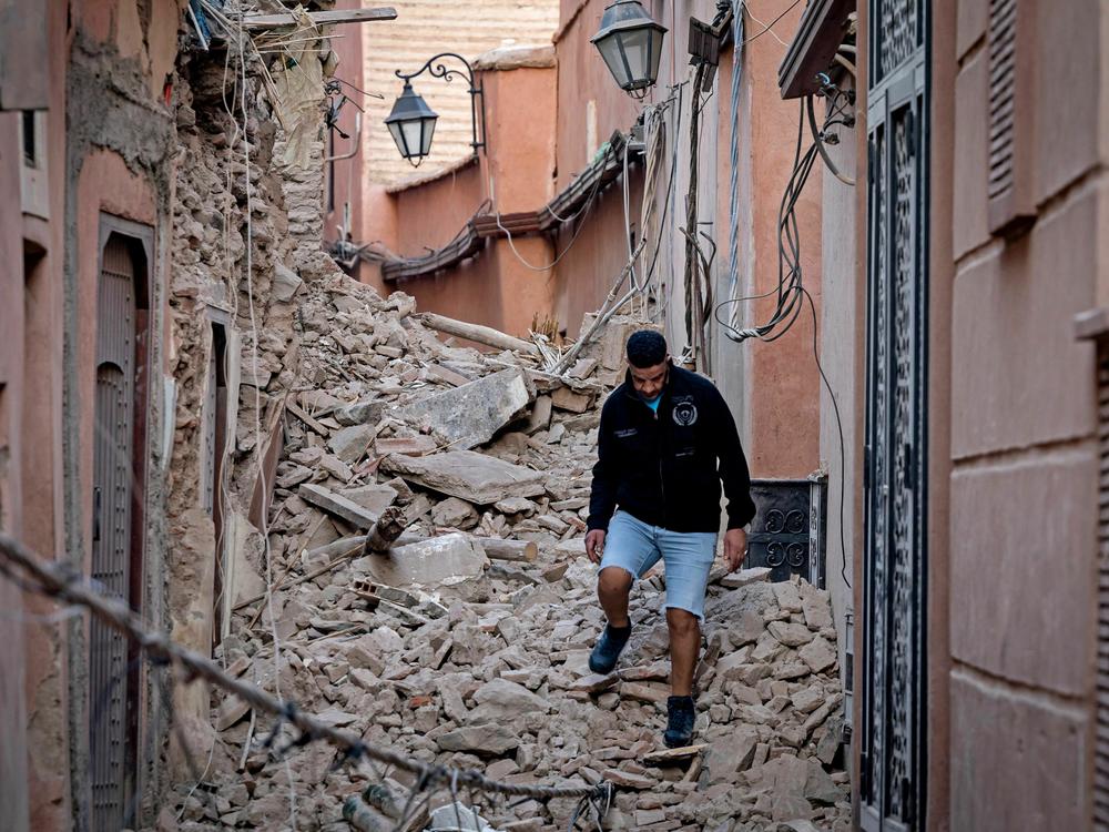 A resident navigates through the rubble on Saturday following a 6.8-magnitude quake in Marrakesh, Morocco.