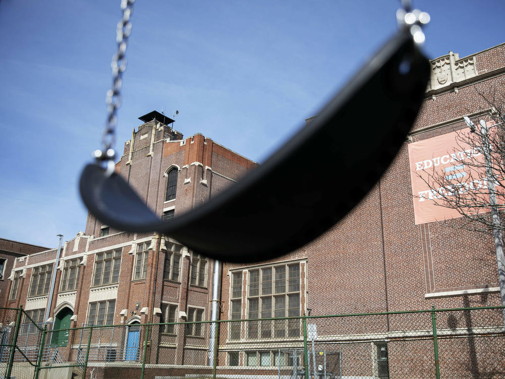A swing sits empty on a playground outside in Providence, R.I. Experts say the end of the expanded child tax credit was a key factor in the big rise in child poverty.