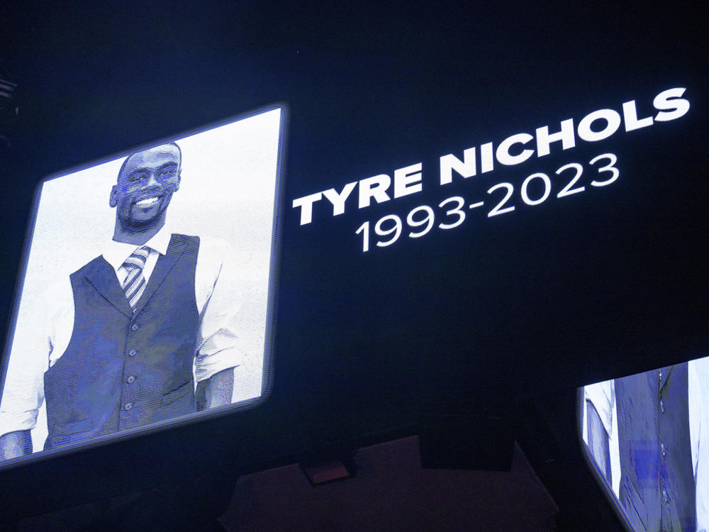 The screen at the Smoothie King Center in New Orleans honors Tyre Nichols before an NBA basketball game between the Pelicans and Wizards, on Jan. 28. On Tuesday, the Justice Department announced charges against the five Memphis police officers involved in his death.