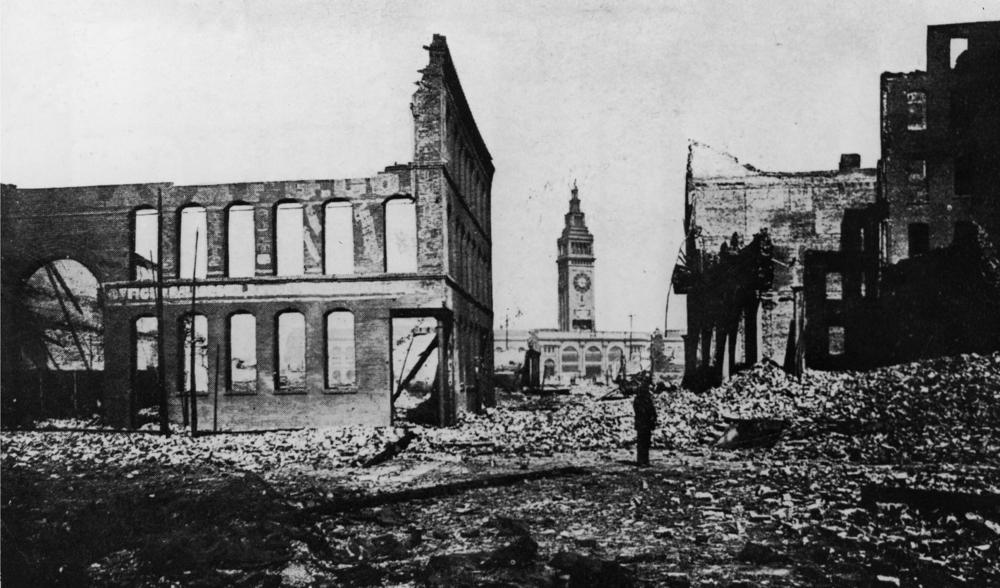 The Ferry Building and clocktower seen through rubble after the 1906 San Francisco earthquake and subsequent fires.