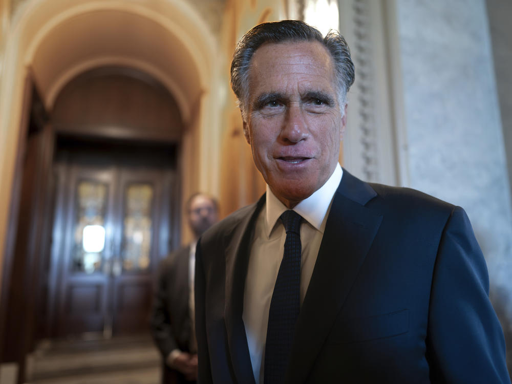 Sen. Mitt Romney, R-Utah, and other senators arrive at the chamber for votes at the U.S. Capitol on September 6.