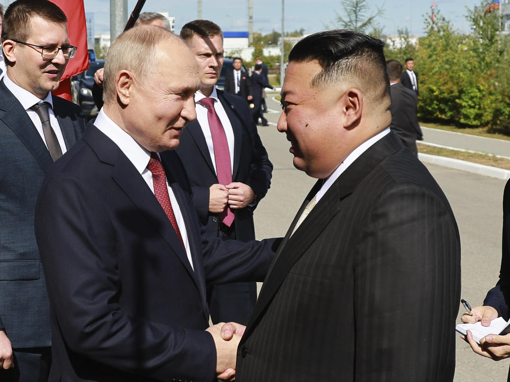 Russian President Vladimir Putin, left, and North Korea's leader Kim Jong Un shake hands during their meeting at the Vostochny cosmodrome outside the city of Tsiolkovsky, about 200 kilometers (125 miles) from the city of Blagoveshchensk in the far eastern Amur region, Russia, on Wednesday, Sept. 13, 2023.