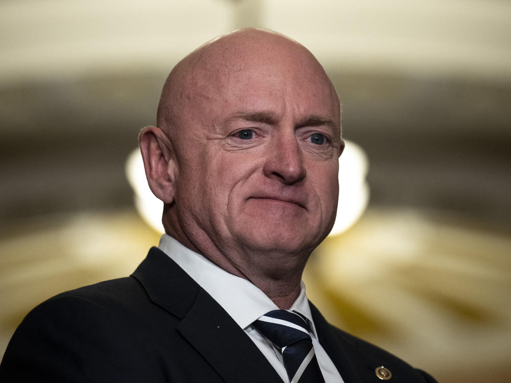 Sen. Mark Kelly (D-AZ) waits to speak during a news conference following a closed-door lunch meeting with Senate Democrats at the U.S. Capitol March 22, 2023 in Washington, D.C.