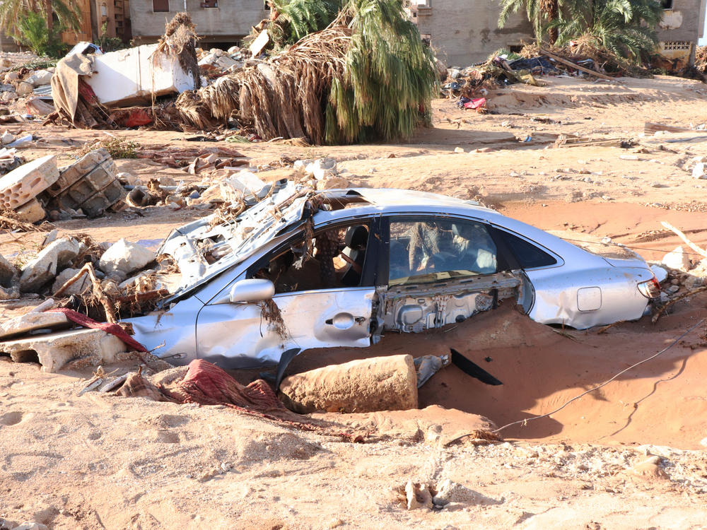 A damaged vehicle is stuck debris after the floods caused by the Storm Daniel ravaged Derna, Libya on September 12.