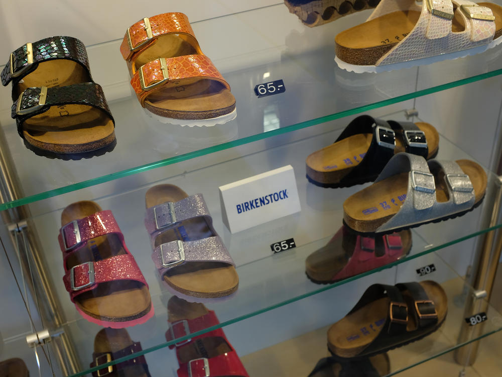 Birkenstock sandals are on display in the window of a store in Berlin.