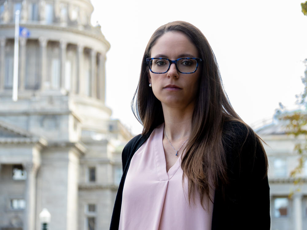 Jennifer Adkins, in front of the Idaho Capitol in Boise, is suing the state after she had to travel to Oregon to end her dangerous, nonviable pregnancy.