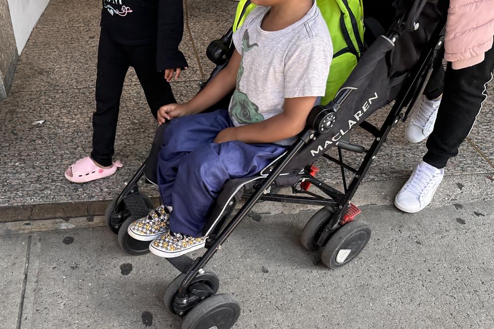 A family outside of  the Dpt. of Education in Long Island City, NY.