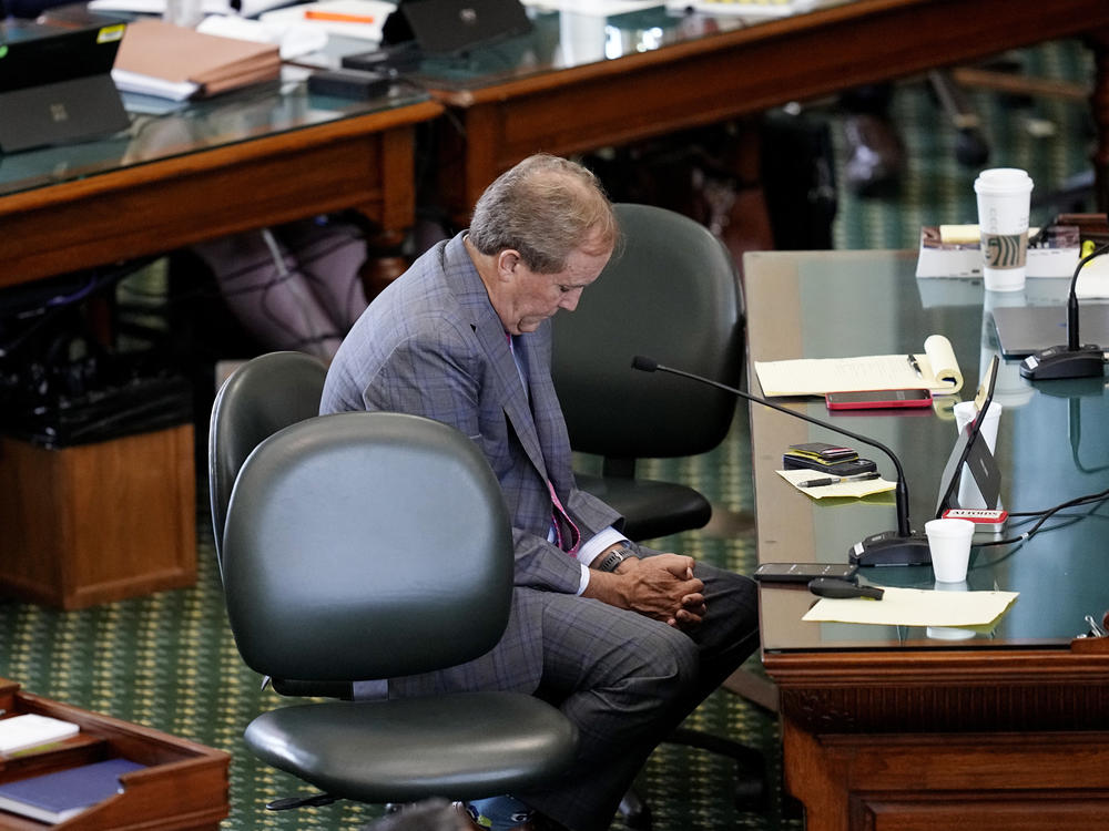 Ken Paxton listens to closing arguments Friday in his impeachment trial in the Texas Senate Chamber in Austin.