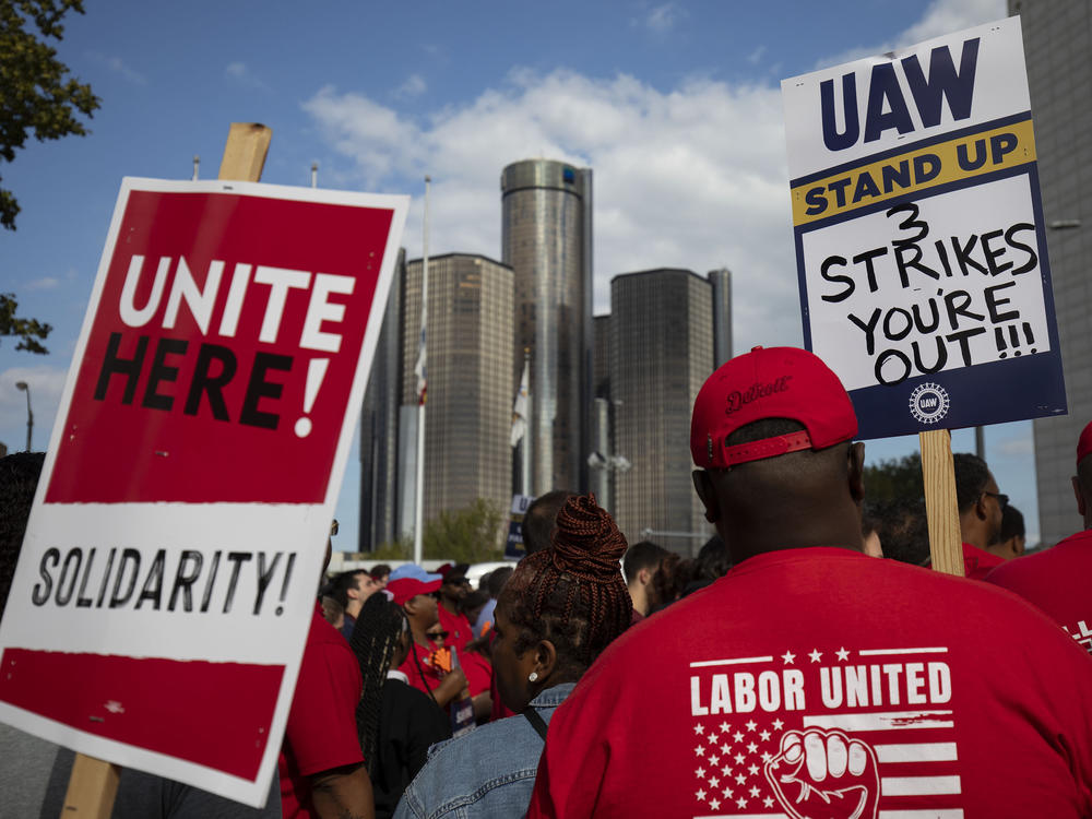 United Auto Workers members attend a solidarity rally in Detroit at the start of the union's strike against Ford, General Motors and Stellantis on Sept. 15. The union is striking against all three automakers at once for the first time ever, but only at targeted plants for now, making it even harder to assess what the strike's economic effects will be.