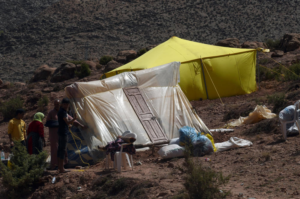 Earthquake survivors shelter in tents and receive humanitarian aid in Imi N'Tala, Morocco, on Sept. 14.