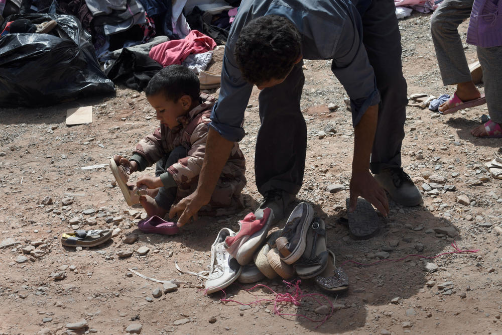 Survivors receive humanitarian aid in Imi N'Tala, Morocco, on Sept. 14.