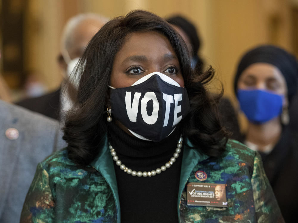 Democratic Rep. Terri Sewell of Alabama wears a mask that says 