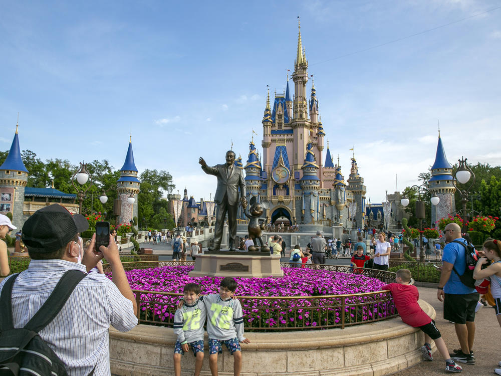 People visit the Magic Kingdom Park at Walt Disney World Resort in Lake Buena Vista, Fla., April 18, 2022.