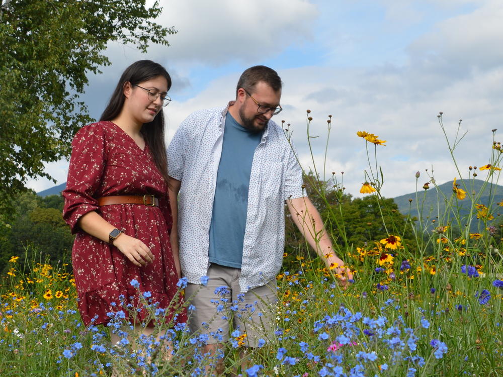 Natalie Gilliard and Jonathan Yacko check out the latest blooms in their lawn-turned-meadow in Vermont