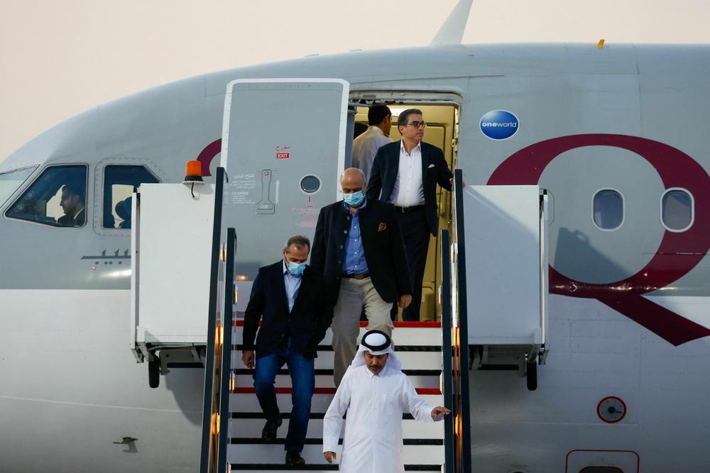 U.S. citizens Siamak Namazi (back), Emad Sharqi (left) and Morad Tahbaz (center) disembark from a Qatari jet on their arrival at the Doha International Airport on Monday.