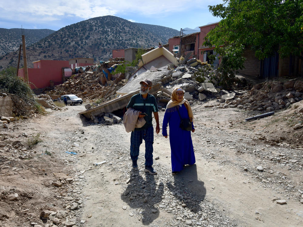 Brother and sister Boujemaa and Aicha Ounasser return home to their birthplace in the Atlas Mountains on Sept. 12 to view the rubble of the devastating earthquake in Tnirte, Morocco.