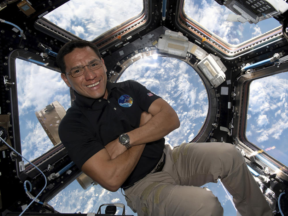 This image provided by NASA shows astronaut Frank Rubio floating inside the cupola, the International Space Station's 