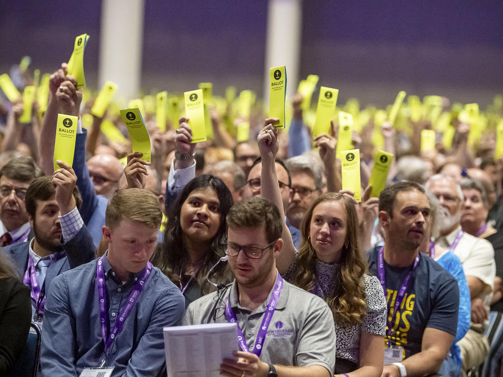 FILE - Delegates hold up their ballots at the Southern Baptist Convention in New Orleans on June 13, 2023. On Tuesday, Sept. 19, 2023, Southern Baptist leaders ousted an Oklahoma church whose pastor defended his blackface performance at one church event and his impersonation of a Native American woman at another.