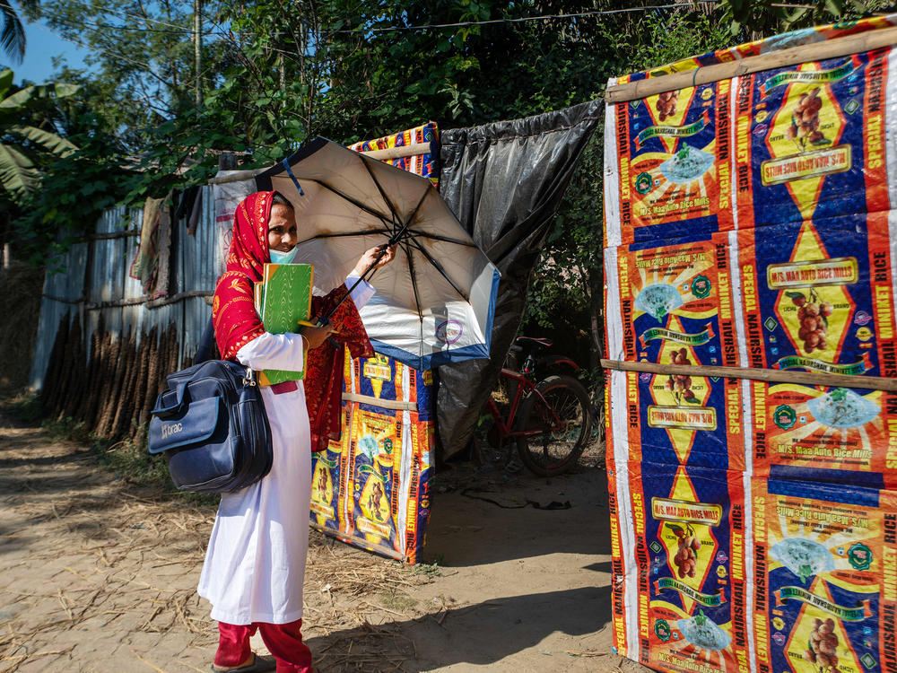 Bulbul Aktar, a s<em>hasthya kormi</em>, or community health worker, with the malaria elimination program in Bangladesh, goes door to door to treat malaria patients. 
