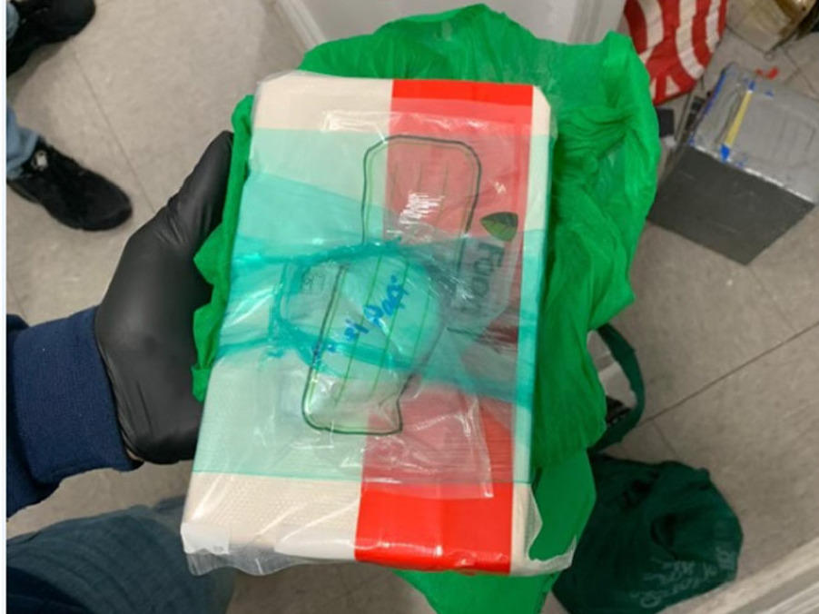 An image from a Drug Enforcement Administration affidavit shows a block of fentanyl and a 