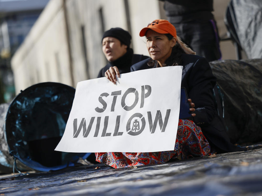Climate activists hold a demonstration to urge President Biden to reject the Willow project on Nov. 17, 2022.