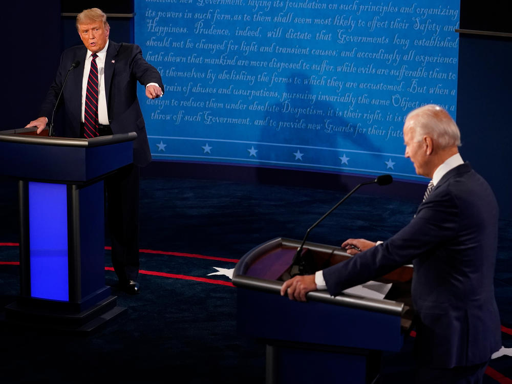 In this file image, then-President Donald Trump and then-former Vice President and Democratic presidential nominee Joe Biden speak during the first presidential debate on Sept. 29, 2020, in Cleveland.