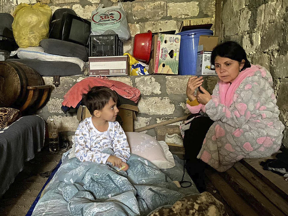 Children take shelter during shelling in Nagorno-Karabakh, as Azerbaijan forces fired artillery at Armenian positions in the breakaway enclave.