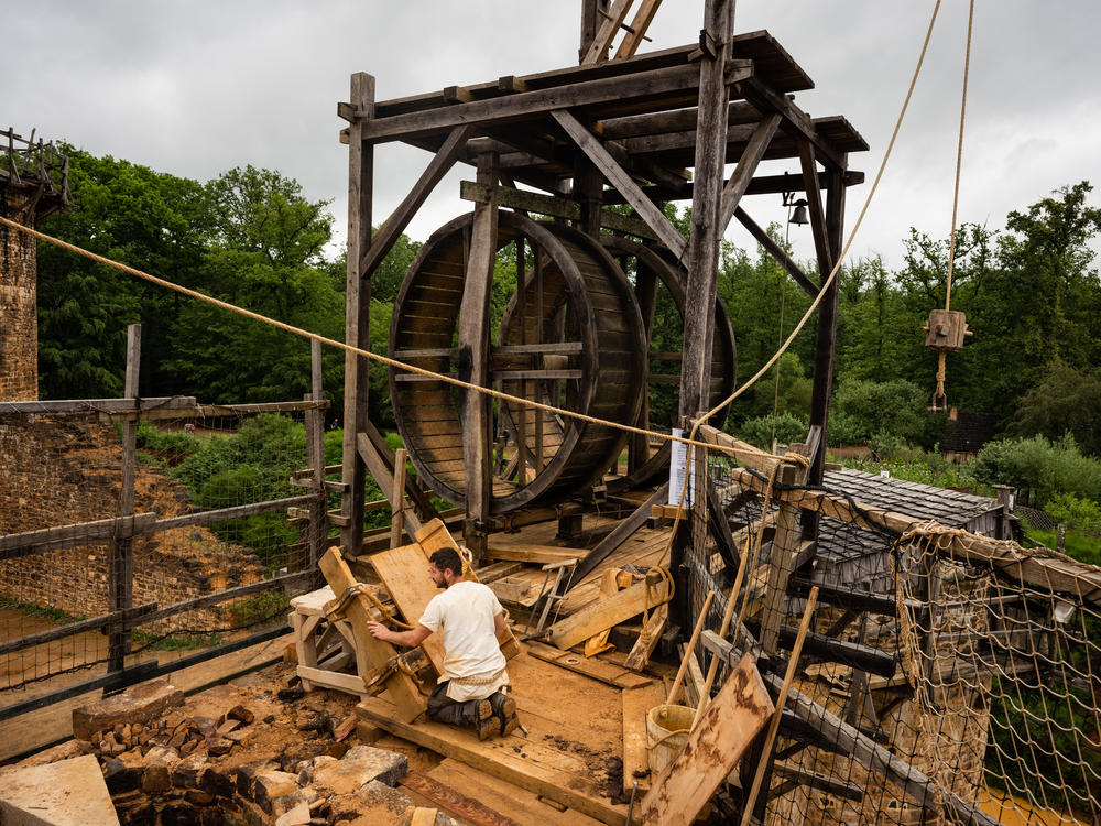 A worker at the Guédelon Castle, where the castle is being built using techniques and tools from the Middle Ages.