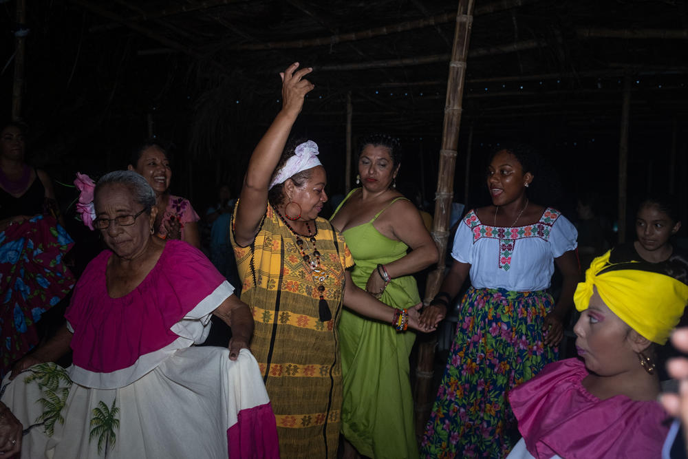 Women at the gathering celebrate with a dance of the devils during at the fisherman's square on July 22.