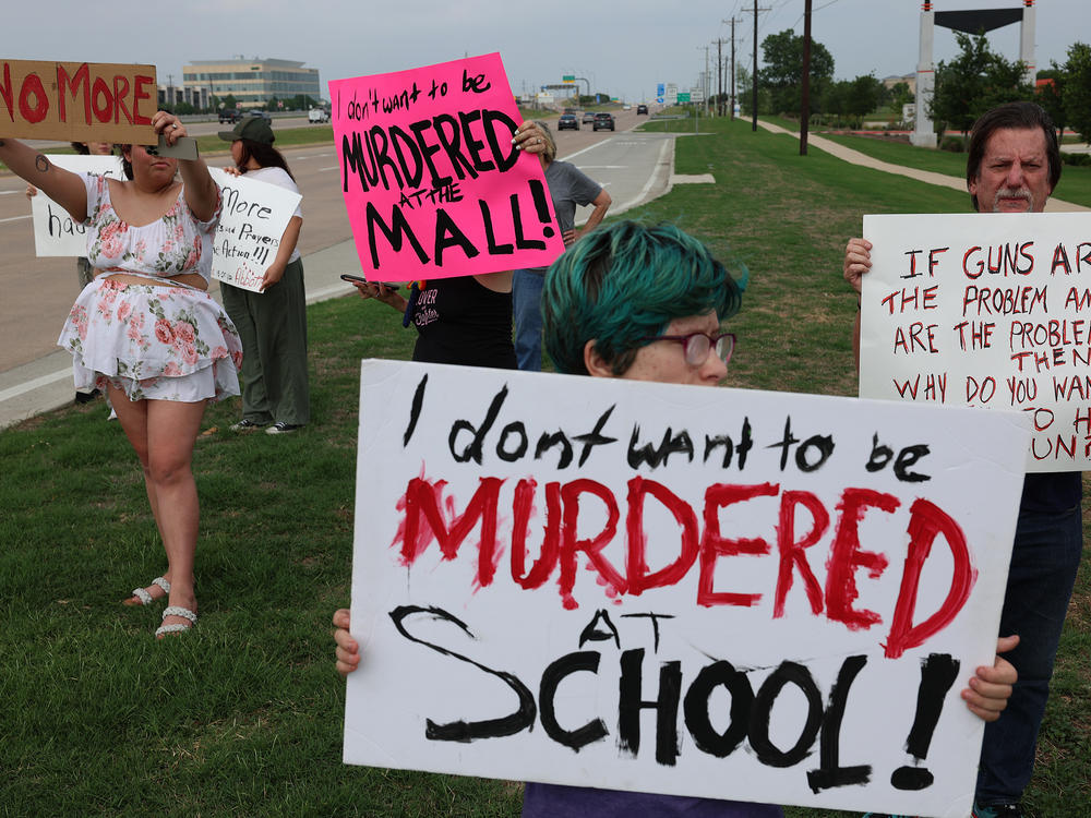 People protest against gun violence on May 7, 2023 in Allen, Texas, after a mass shooting at an outlet mall in the community.