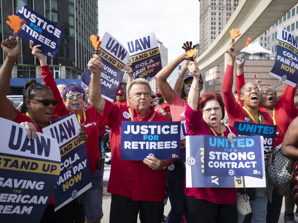 UAW members attend a solidarity rally as the UAW strikes the Big Three automakers on Sept. 15 in Detroit. GM announced temporary layoffs on Wednesday, blaming the strikes.