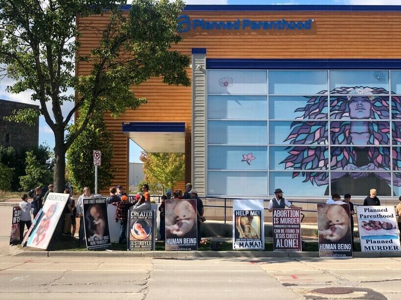 Anti-abortion demonstrators gather outside Planned Parenthood's Water Street Health Center in Milwaukee on Monday, Sept. 2023. Planned Parenthood of Wisconsin began offering abortions at the clinic that day after not doing so for more than a year.<em> </em>