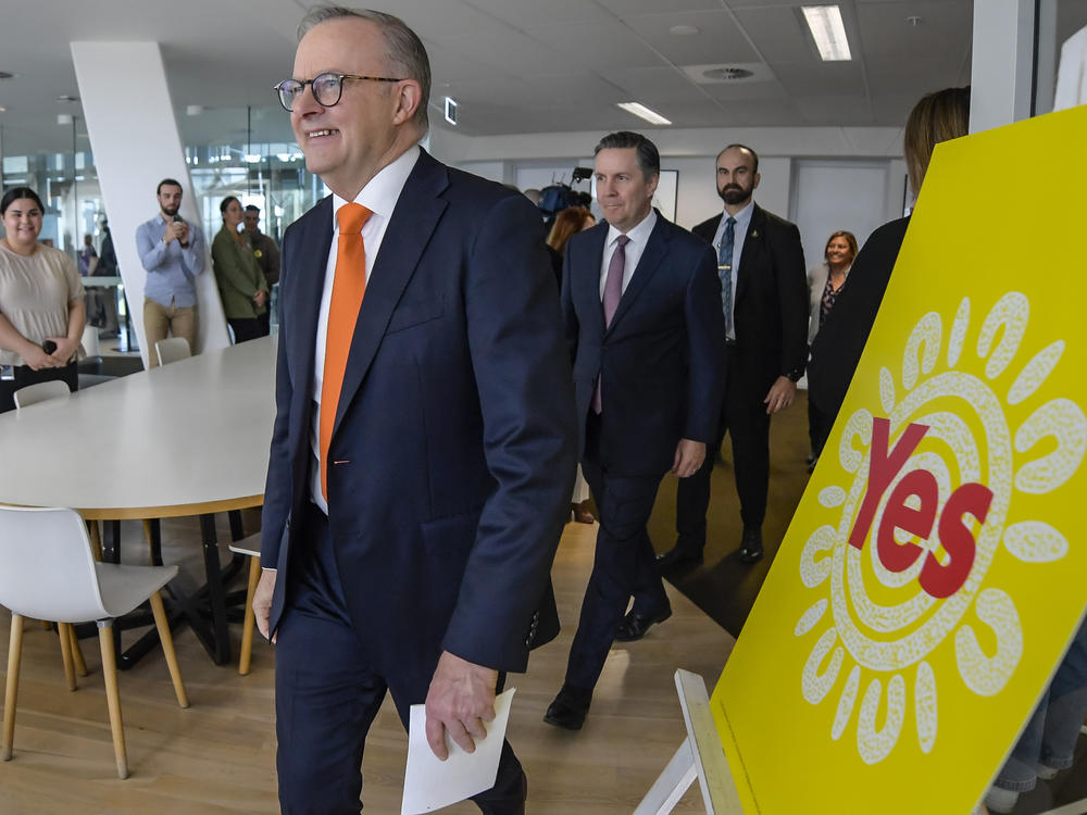 Australian Prime Minister Anthony Albanese, foreground, walks past a 