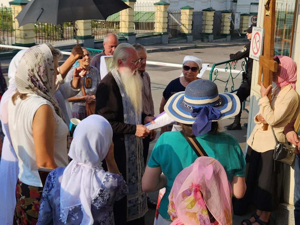 Worshippers loyal to the Moscow-affiliated Orthodox church gather for a protest service outside a monastery in Kyiv. Many believers say they're loyal both to Ukraine and their traditional faith.