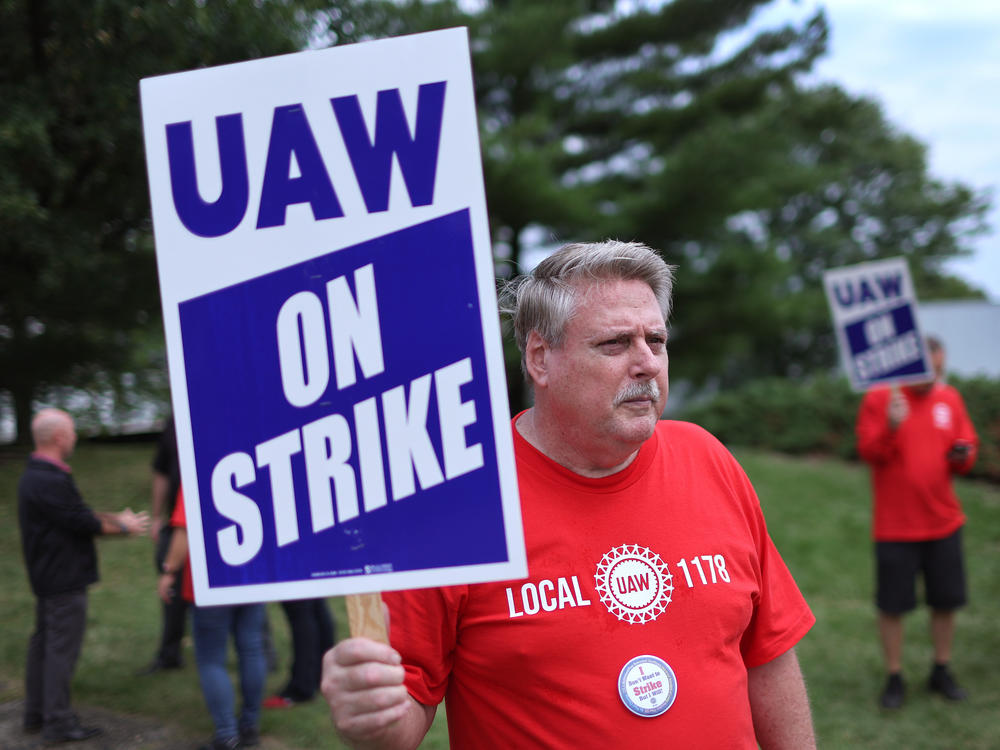 UAW workers picket outside of the Stellantis Mopar parts facility in Naperville, Ill., on Sept. 22, 2023. The UAW strike against Big Three automakers may not have much of an impact on car shoppers, though that could change.