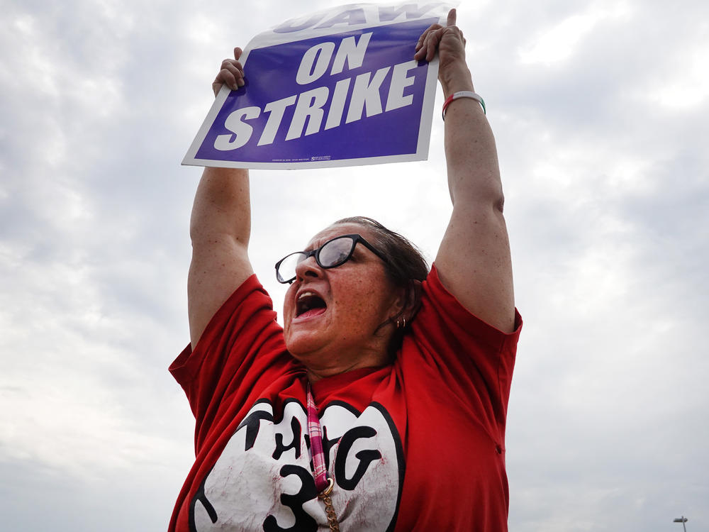 UAW workers picket outside of the Stellantis Mopar parts facility in Naperville, Ill., on Sept. 22, 2023. The union is expanding its strike against GM and Stellantis citing the lack of progress in talks for a new contract.