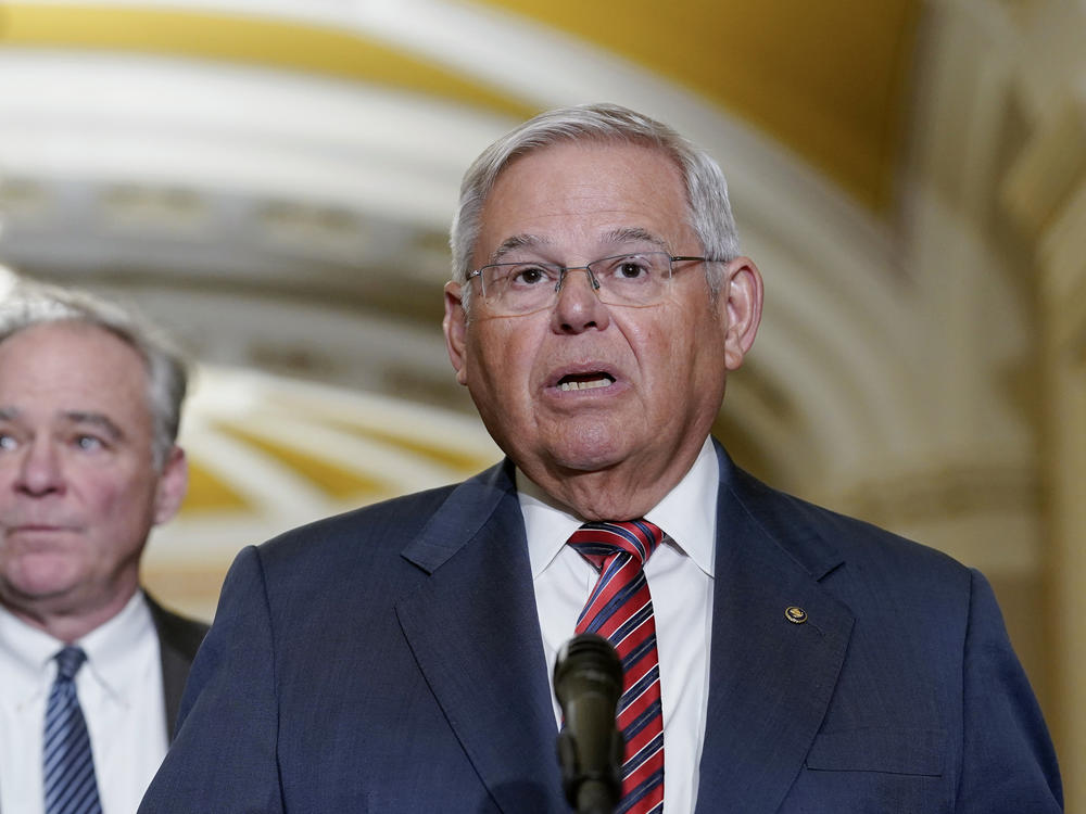 Sen. Bob Menendez, D-N.J., speaks as Sen. Tim Kaine, D-Va., listens during a news conference March 15 on Capitol Hill in Washington.