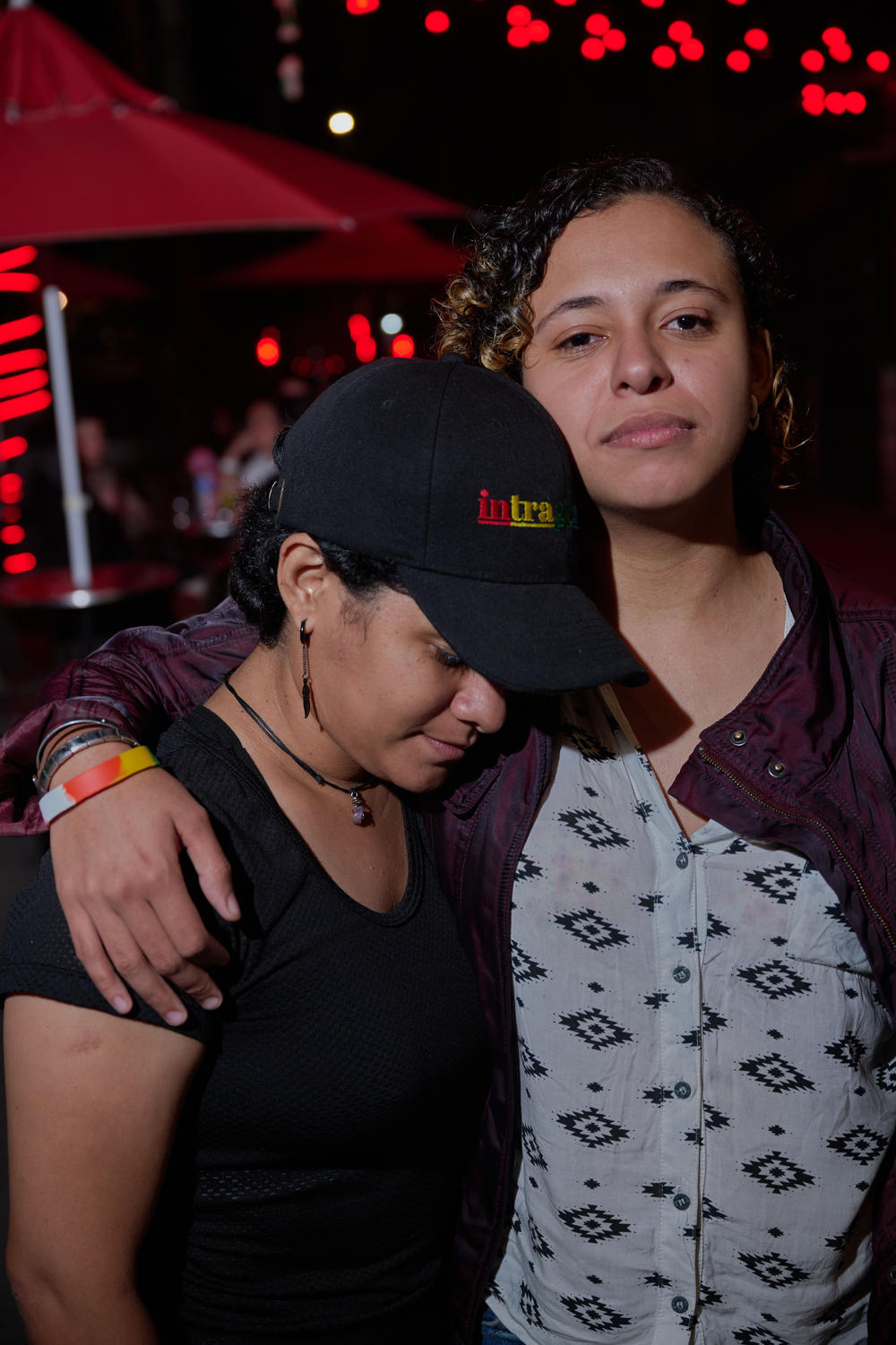 Tay and Carolina pose for a portrait in downtown Medellín. Carolina is Tay's girlfriend, pictured wearing an Intragender cap — the collective Tay founded that focuses on issues of violence within queer relationships.