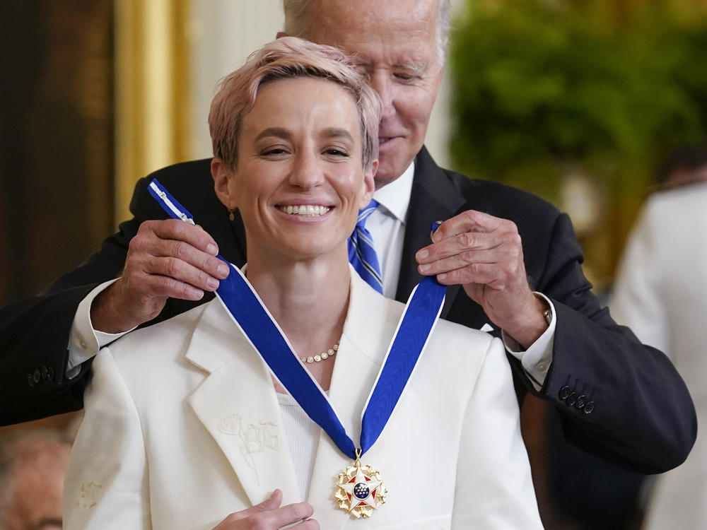 President Joe Biden awards the nation's highest civilian honor, the Presidential Medal of Freedom, to Rapinoe at the White House in July 2022.