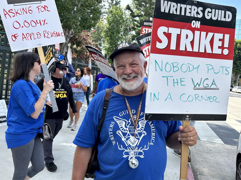 Brian Nelson has been a WGA member for 30 years. On the picket line outside CBS Radford Studios on Friday, The screenwriter said 