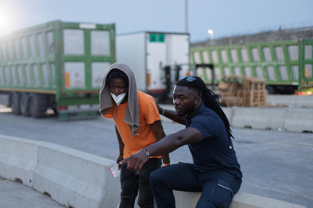 Moussa Koulibaly offers help at the port of Lampedusa, Sept. 20.