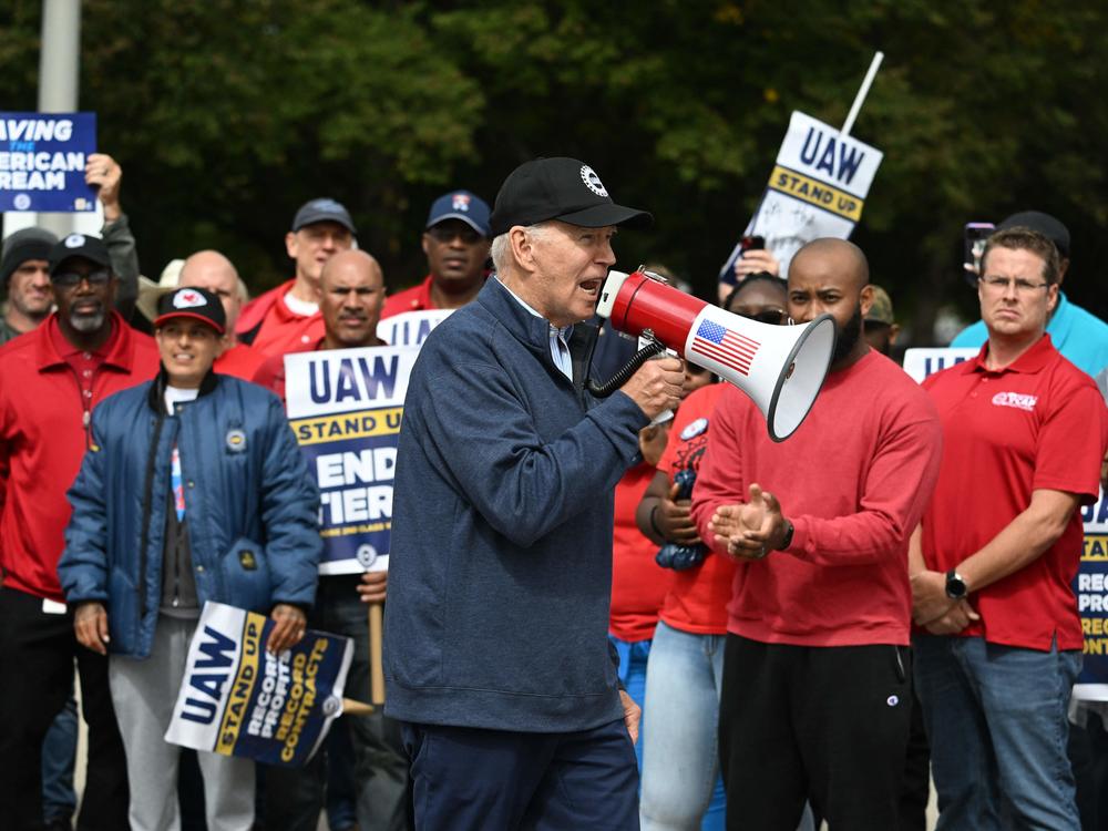 President Biden addresses striking members of the UAW on a picket line outside a GM plant in Belleville, Michigan, on September 26, 2023.