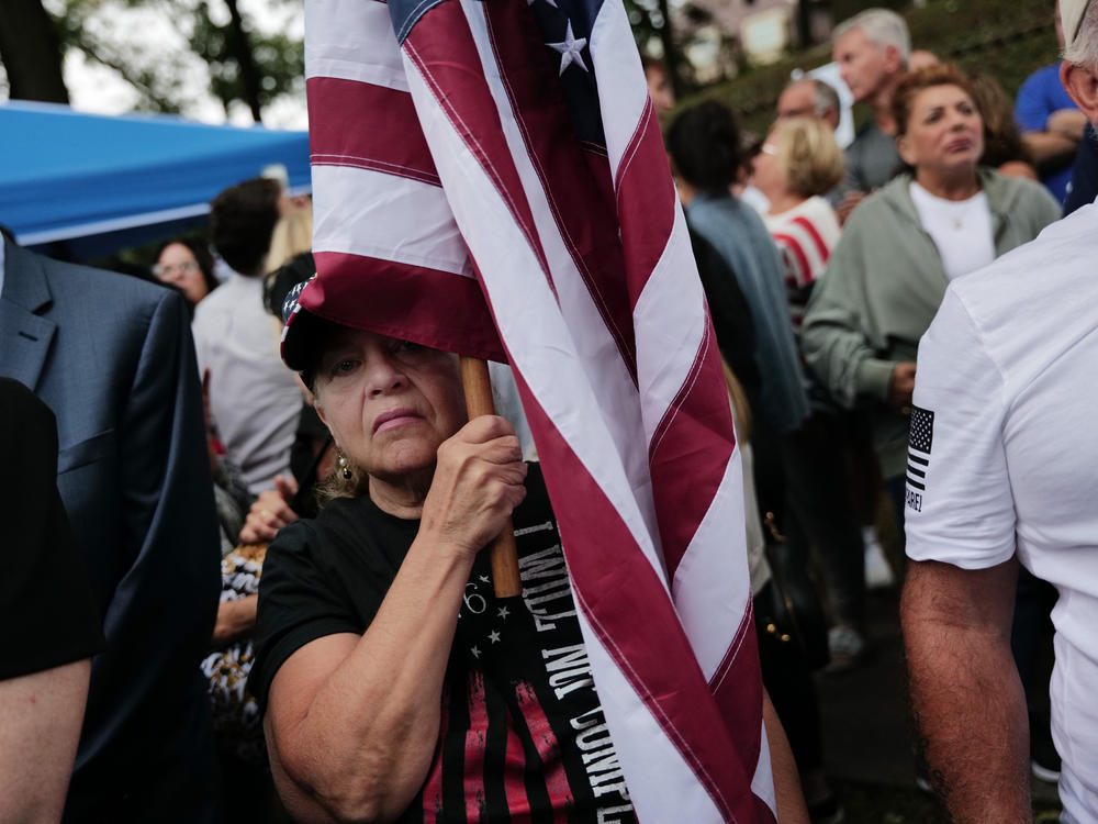 Staten Island residents protest outside a closed Catholic school-turned-migrant shelter on Staten Island, N.Y., on Aug. 28.