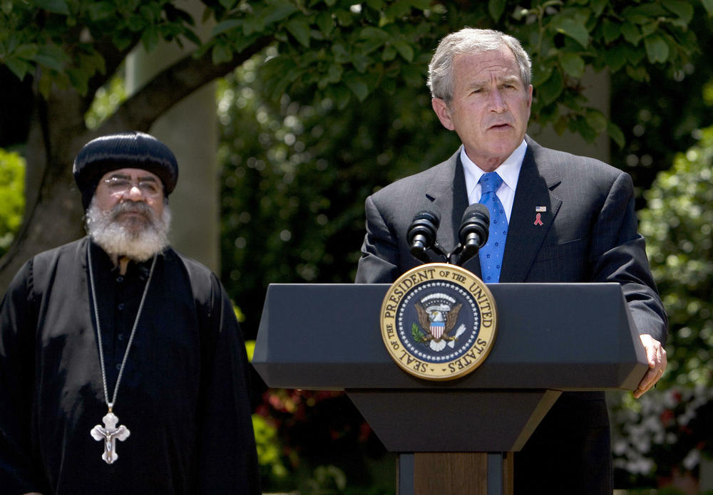 President George W. Bush speaks on the President's Emergency Plan for AIDS Relief in the White House Rose Garden in 2007. Bush launched the widely hailed program, which is currently being criticized by factions who say it supports abortion rights. In a 2023 op-ed in the <em>Washington Post</em>, Bush wrote: 
